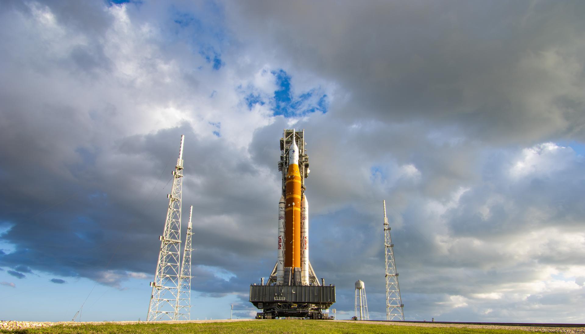 This image shows NASA’s SLS (Space Launch System) and Orion spacecraft rolling out of the Vehicle Assembly Building at NASA’s Kennedy Space Center. NASA's massive Crawler-Transporter, upgraded for the Artemis program, carries the powerful SLS rocket and Orion spacecraft on the Mobile Launcher from the Vehicle Assembly Building to Launch Pad 39B at Kennedy Space Center in preparation for the Artemis II mission. 